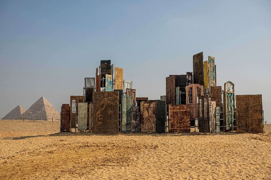 The art installation "Doors of Cairo" by artist Alexandre Farto, aka Vhils, formed part of the fifth edition of the "Forever is Now" art exhibition by Art d'Egypte at the Giza pyramids