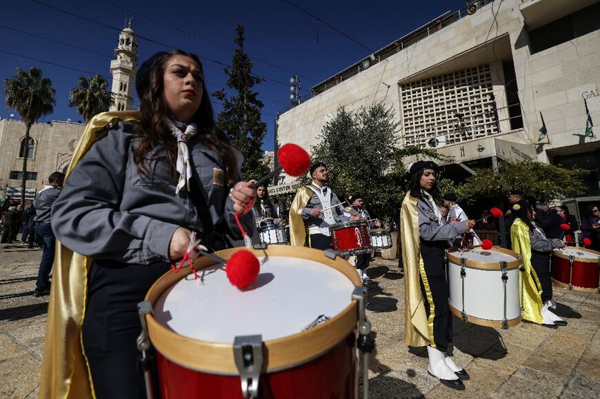 Christian scouts march during Christmas eve celebrations at the Manger Square outside the Church of the Nativity in Bethlehem, in the Israeli-occupied West Bank