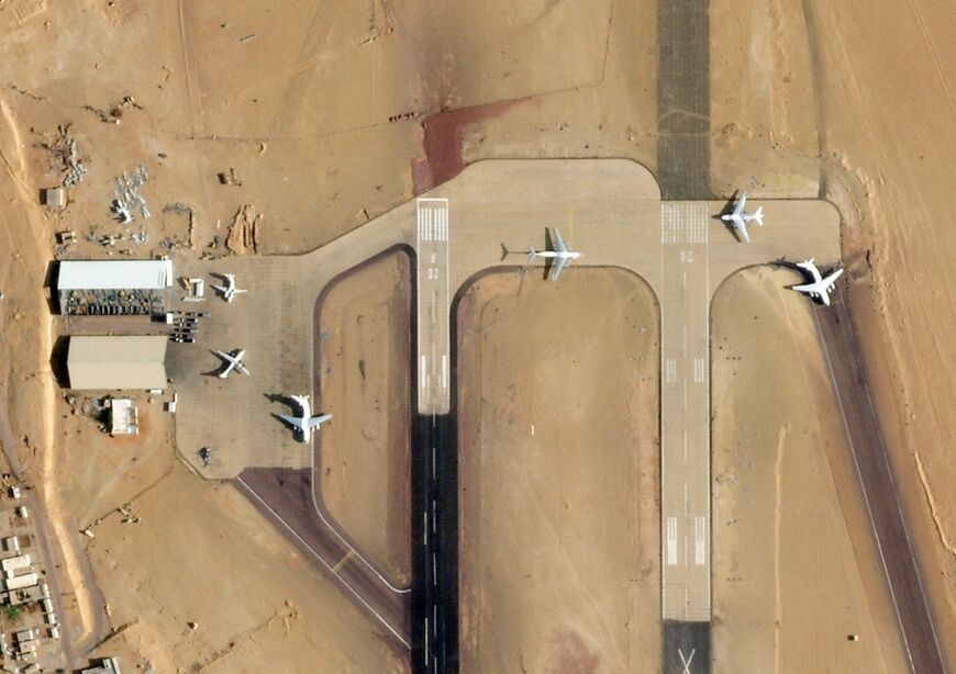 This handout satellite image from 2025 Planet Labs PBC shows the UAE-loyalist airbase in Kufra, southeastern Libya, on October 7, 2025, with four Ilyushin Il-76D aircraft reportedly used to transport weapons and mercenaries to Sudan