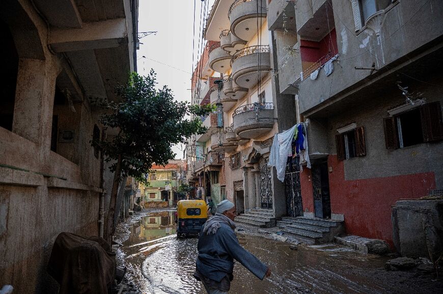 Rain floods the Nagrig street where Mohamed Salah grew up