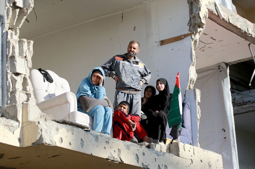 But the backdrop told a different story: dilapidated buildings, piles of concrete and rubble, the scars of two years of conflict in Gaza