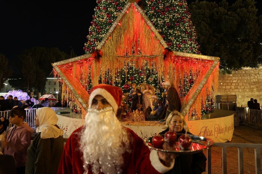 Crowds gathered in Bethlehem before midnight mass at the Nativity Church to usher in Christmas Day