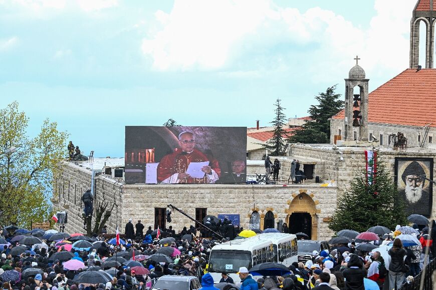 Thousands of people braved the rain to see the pope