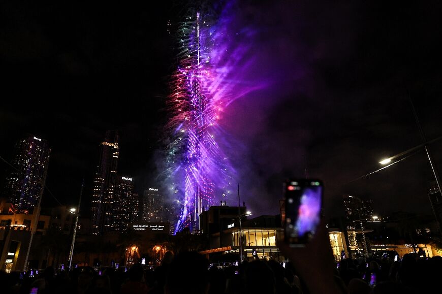 Fireworks light up the sky around the Burj Khalifa Tower in Dubai
