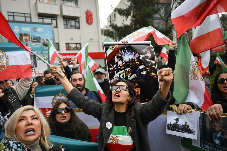 Protesters held flags of Iran from before the 1979 Islamic revolution as they demonstrated against the Iranian authorities in Turkey  
