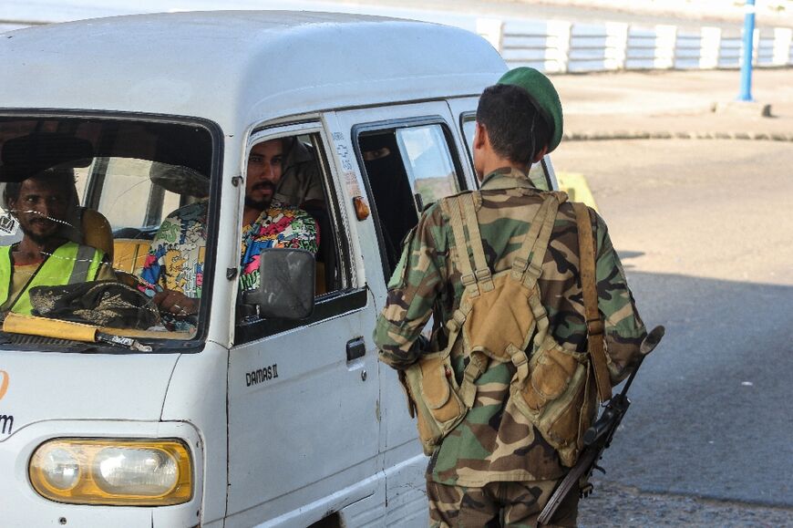 A member of the security forces mans a checkpoint in Aden, where Yemen's internationally recognised government is based