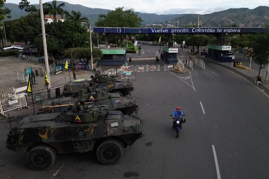 Colombian soldiers in military vehicles monitor the border crossing with Venezuela in the days after US forces captured Venezuela's leftist leader Nicolas Maduro