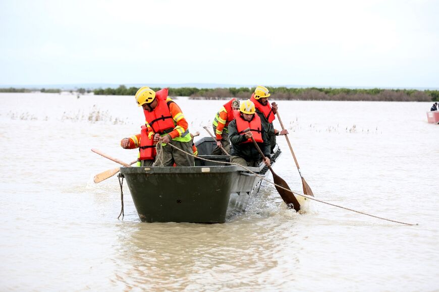 Some stranded residents were rescued by boat after roads were cut off