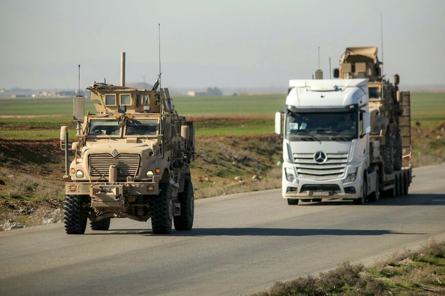 US military vehicles have been seen moving in convoy along highways outside Qamishli as the force withdraws from Syria