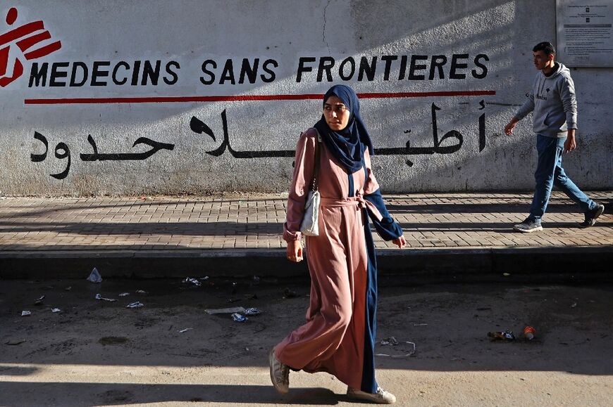Palestinians walk past the MSF clinic in Gaza City's al-Rimal neighbourhood