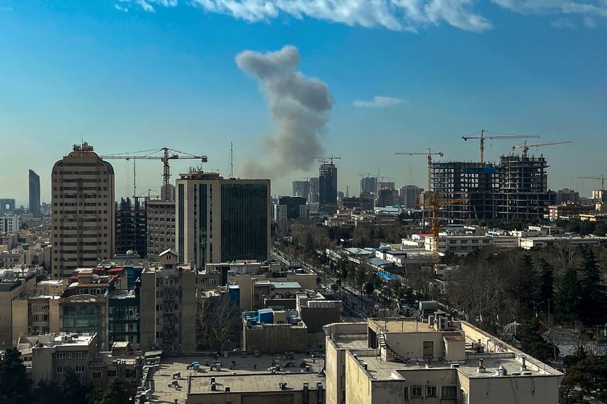 Smoke rose above Tehran after explosions were heard