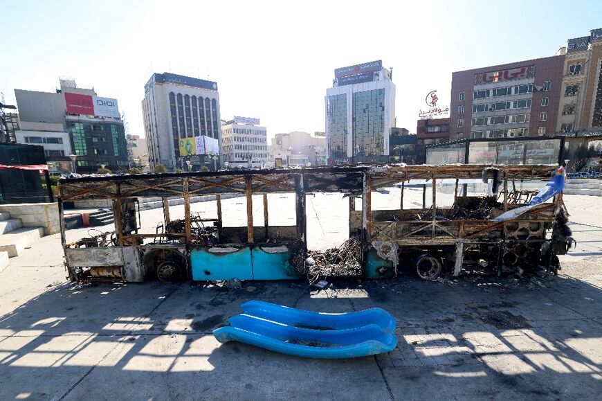 A destroyed bus in Tehran's Haftome-tir Square