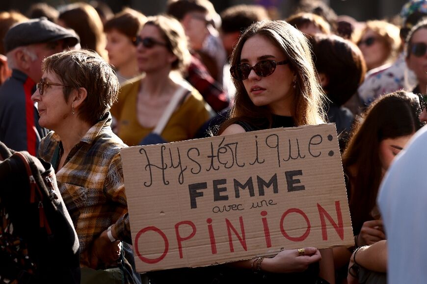 'Hysterical: woman with an opinion,' read one sign as thousands marched for women's rights Sunday