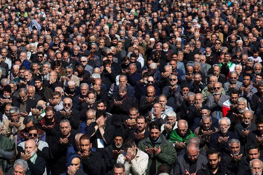Muslims take part in Friday noon prayers at the compound of the Mosalla mosque in Tehran