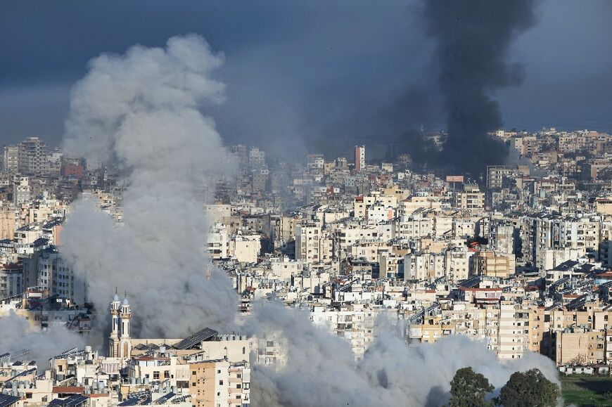 Plumes of smoke rise from the sites of Israeli airstrikes on the southern suburbs of Beirut