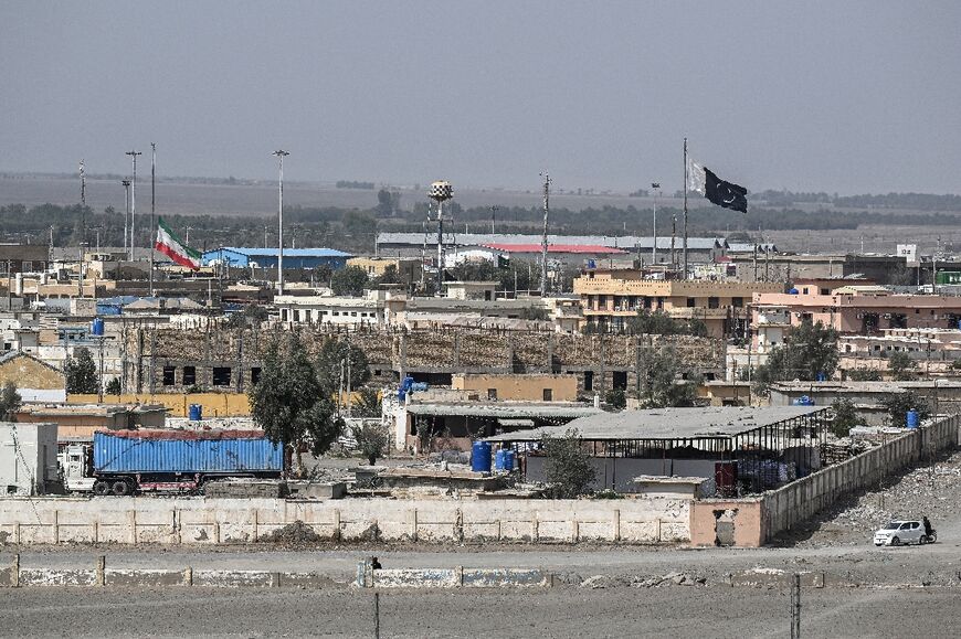 An Iranian flag flies at half-staff at the Pakistan-Iran border crossing at Taftan