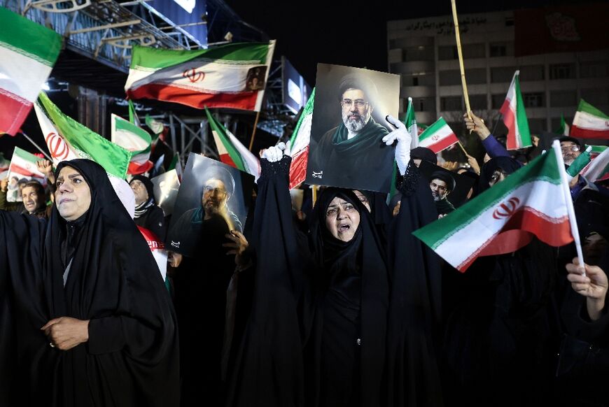People march in support of the Iranian armed forces in central Tehran on March 25, 2026