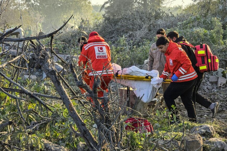 First aid responders evacuate a body from the site of an Israeli airstrike that targeted the southern Lebanese city of Tyre