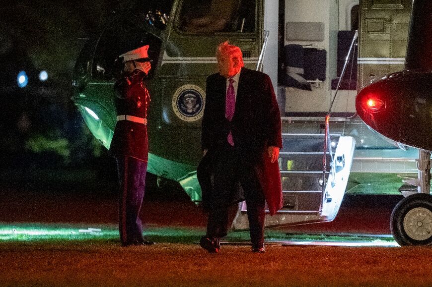 US President Donald Trump steps off Marine One on the South Lawn upon returning to the White House from a weekend at his Mar-a-Lago resort