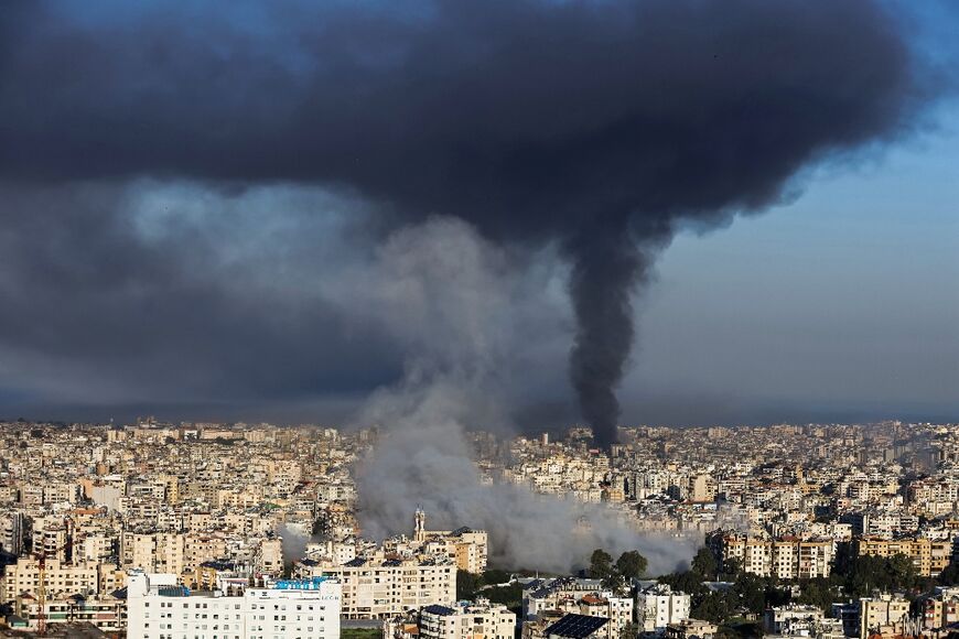 Plumes of smoke rise from the sites of Israeli airstrikes on the southern suburbs of Beirut