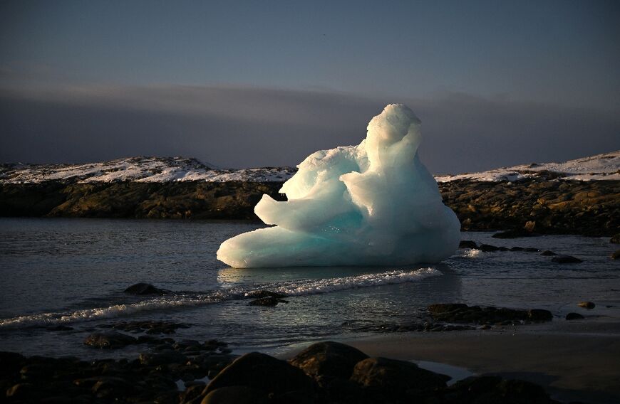 An ice block on the shore in Nuuk, western Greenland. The Antarctic and Greenland ice sheets have both lost significant mass