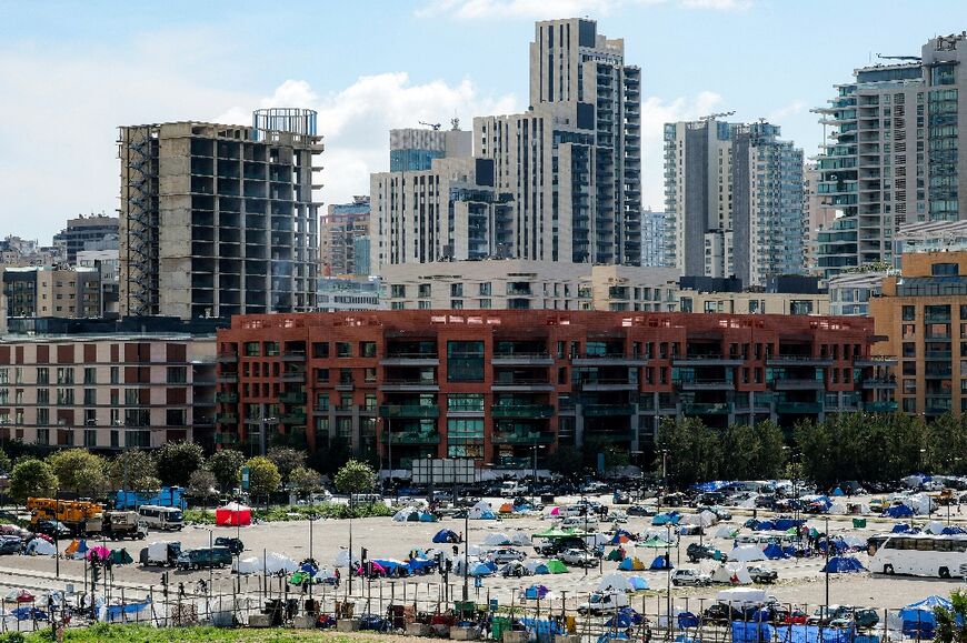 Makeshift tent encampments for people displaced by the war at a parking area near Beirut's waterfront on Thursday