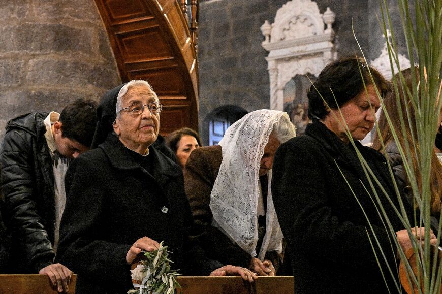 Members of the congregation at the Palm Sunday service