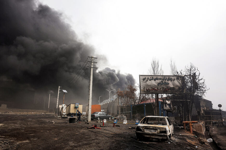 Smoke plumes rise from an ongoing fire following an overnight airstrike on the Shahran oil refinery in northwestern Tehran on March 8, 2026. The United States and Israel launched strikes against Iran on February 28, sparking swift retaliation by the Islamic republic which responded with missile attacks across the region. The war has dragged in global powers, upended the world's energy and transport sectors, and brought chaos to even usually peaceful areas of the volatile region. (Photo by AFP via Getty Imag