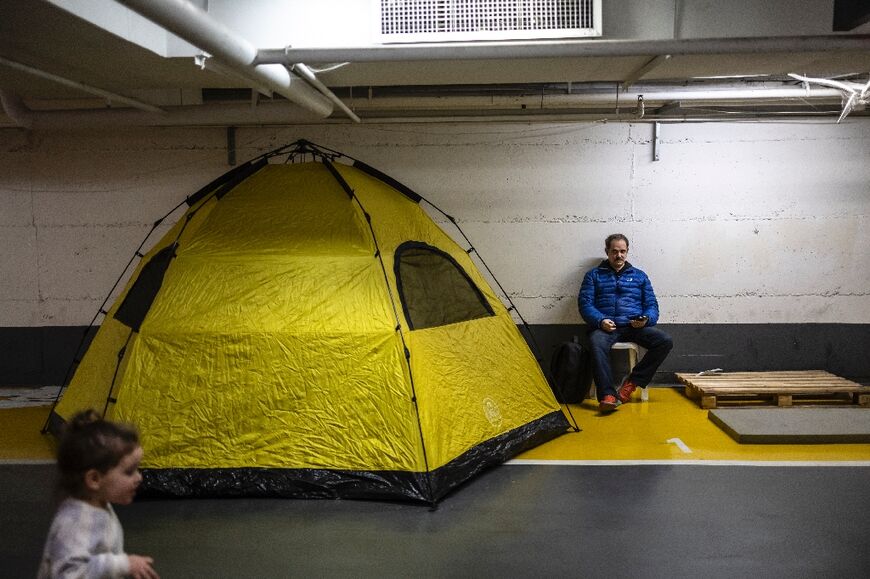 A man in an underground parking used as a bomb shelter during an alert in Israel's Tel Aviv