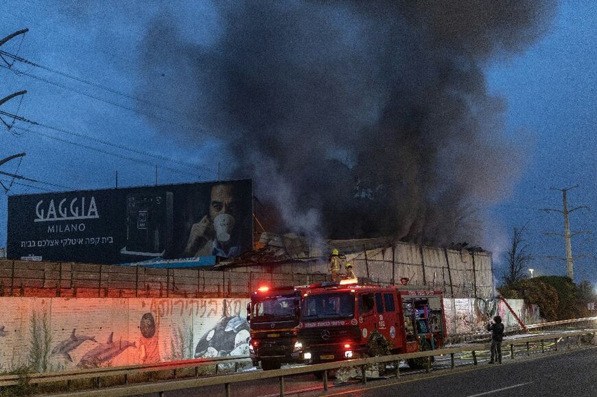 Smoke could be seen rising from two locations around Israel's commercial hub Tel Aviv