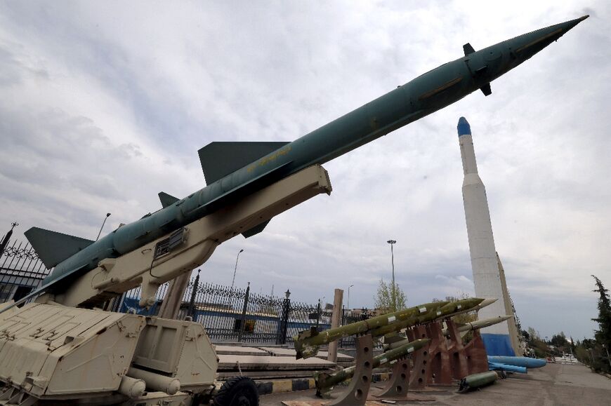Mockups of Iranian-made missiles are displayed at an exhibition outside the Defence Museum in Tehran