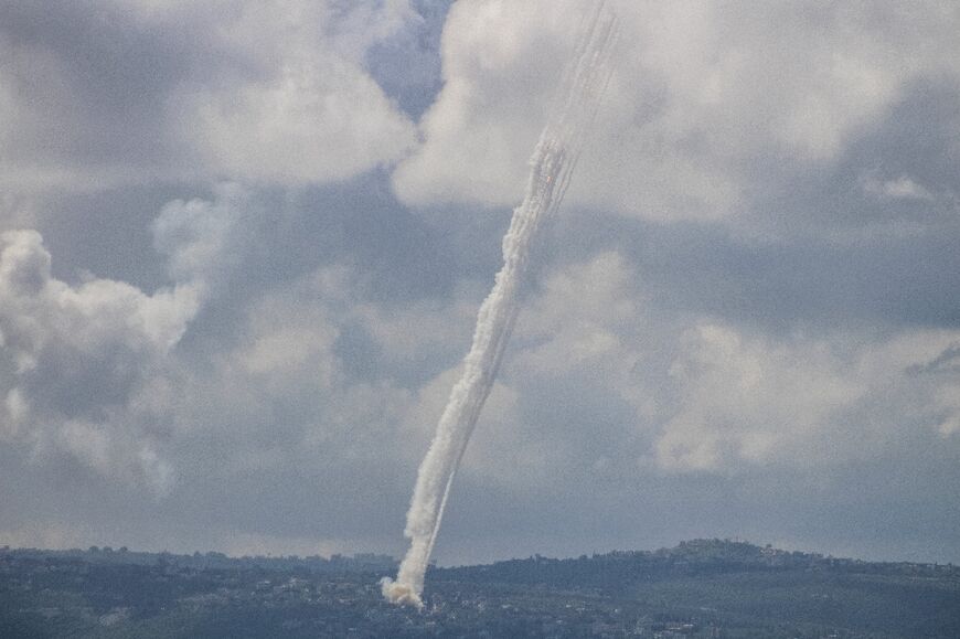 This photograph taken from the southern city of Tyre, shows rockets fired from Lebanon towards Israel on March 24, 2026