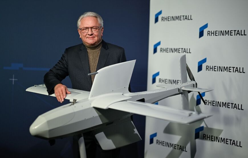 Rheinmetall CEO Armin Papperger with one of the company's strike drones