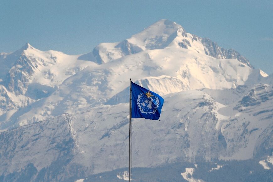 The WMO flag seen above its headquarters in Geneva, in front of the Mont Blanc massif