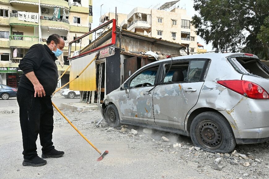 Clearing away debris as displaced people return to their battered neighbourhood in Beirut's southern suburbs