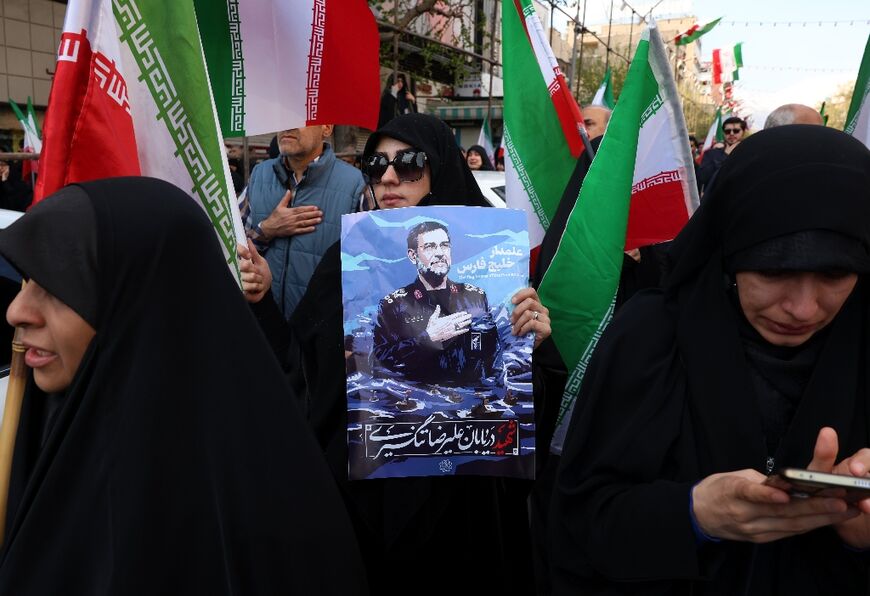 Pro-government Iranians were defiant at the funeral of a Guards commander killed in an Israeli strike