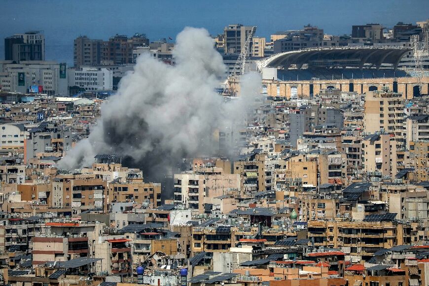 Smoke rises from the site of an Israeli strike in Beirut's southern suburbs, near Camille Chamoun Sports City stadium