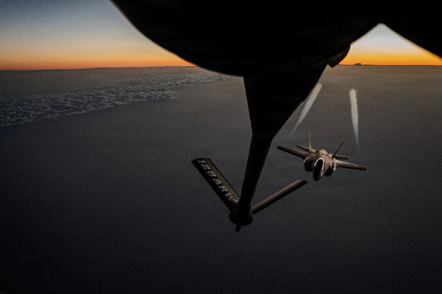 A US Air Force KC-135 Stratotanker aircraft refuels a F-35A Lightning II aircraft during Operation Epic Fury 