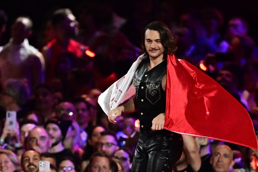 Maltese singer Aidan carried the national flag on the catwalk at the Wiener Stadthalle