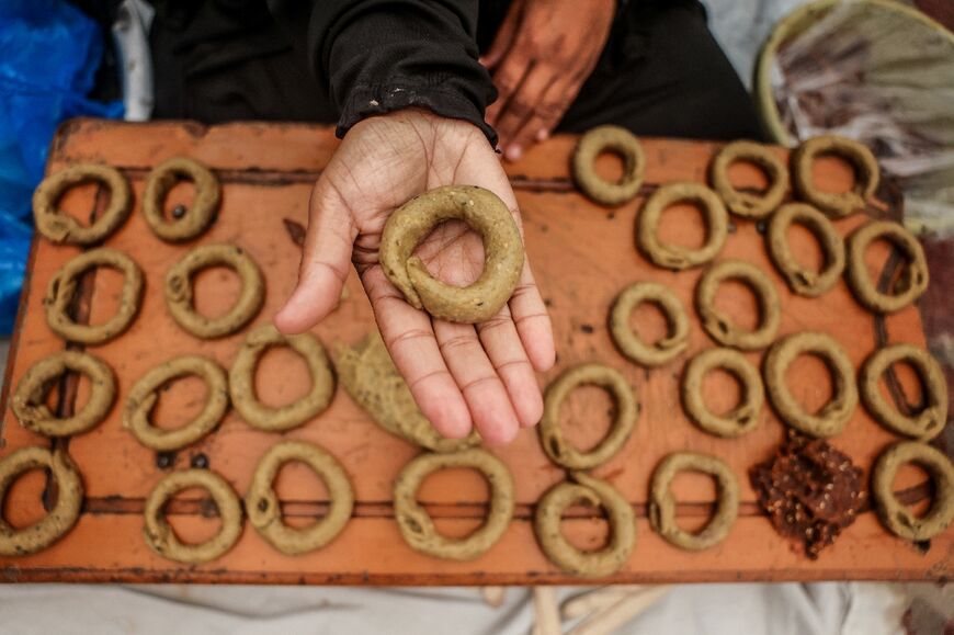 Very few Palestinians are able to make Eid biscuits in their tents due to high prices of cooking gas