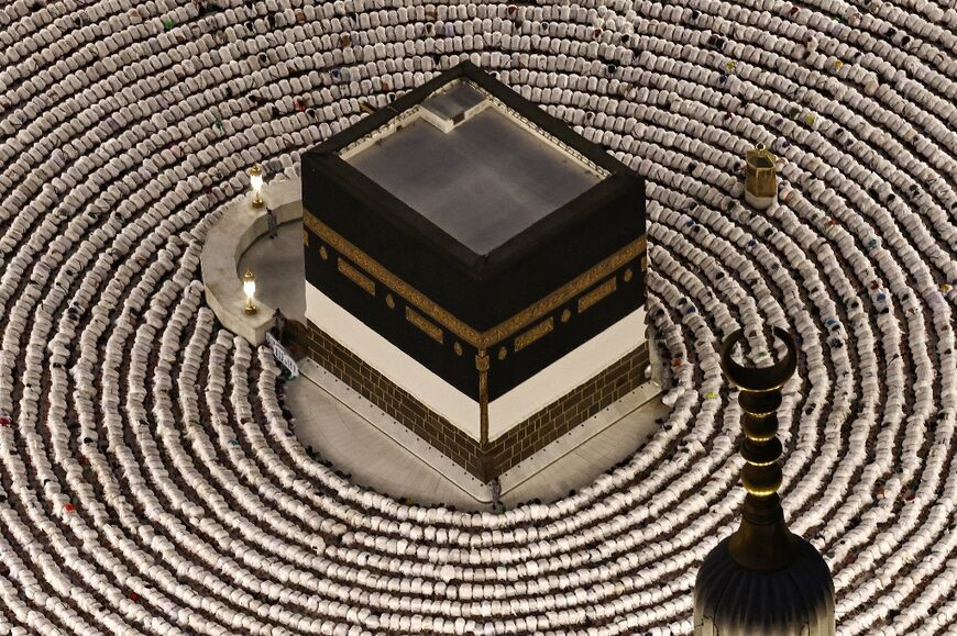Muslims at Mecca's Grand Mosque perform the evening prayer around the Kaaba, Islam's holiest shrine, ahead of the annual hajj