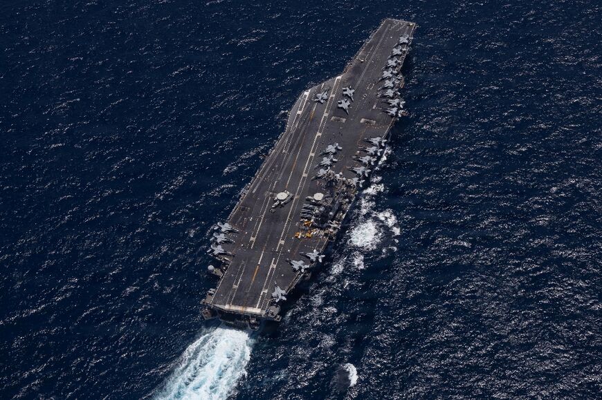 This US Navy handout photo shows Nimitz-class aircraft carrier USS George H.W. Bush sailing in the Arabian Sea