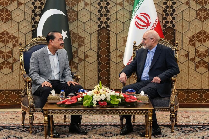 In this handout picture provided by the Islamic Consultative Assembly News Agency (ICANA), Iran's Parliament Speaker Mohammad Bagher Ghalibaf meets with Pakistan's army chief Syed Asim Munir in Tehran on May 23, 2026