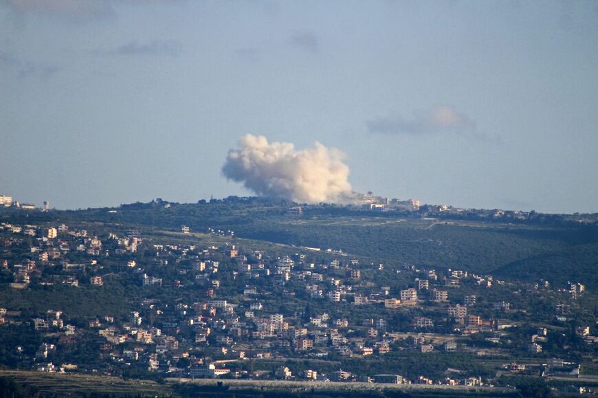 This photograph taken from the southern Lebanese area of Tyre shows smoke rising from an Israeli controlled explosion in the village of Chamaa on May 1, 2026