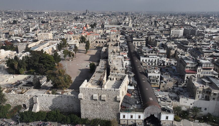 An aerial view shows the Damascus Citadel and the al-Hamidiya market in the old city of Syria's capital Damascus on December 12, 2024. 