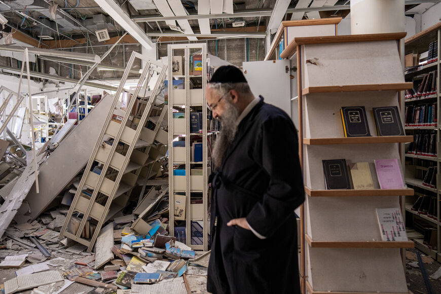 People survey the damage following an Iranian missile strike on the Beit Ya’akov girls' high school on April 6, 2026 in Tel Aviv, Israel. Iran has continued firing waves of drones and missiles at Israel after the United States and Israel launched a joint attack on Iran early on February 28th. (Photo by Erik Marmor/Getty Images)