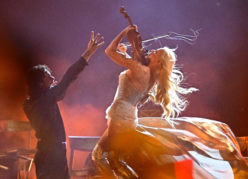 Violinist Linda Lampenius and singer Pete Parkkonen, represented Finland with the song 'Liekinheitin'