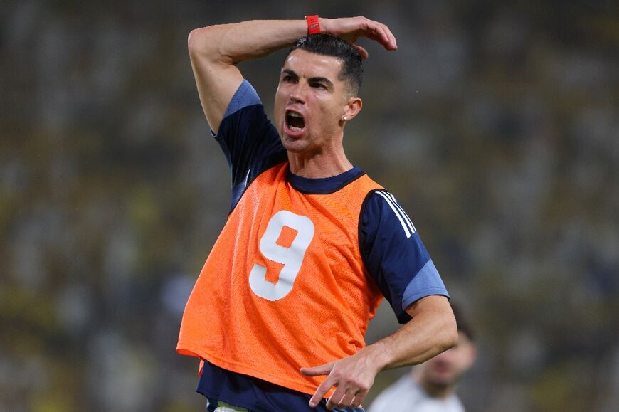 Cristiano Ronaldo exhorts the crowd before  Al-Nassr faced  Damac chasing the Saudi title 