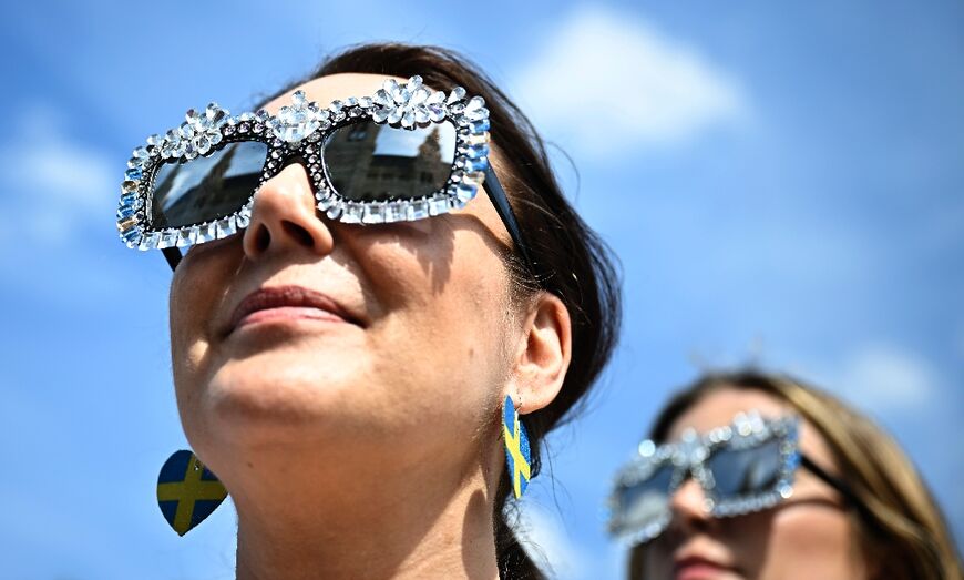 Vienna City Hall reflected in the sunglasses of a Eurovision fan in the Austrian capital