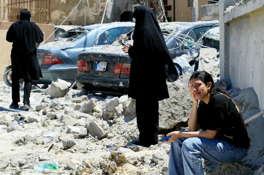 A woman weeps at the site of an Israeli airstrike that targeted the southern Lebanese village of Qennarit on June 20, 2026